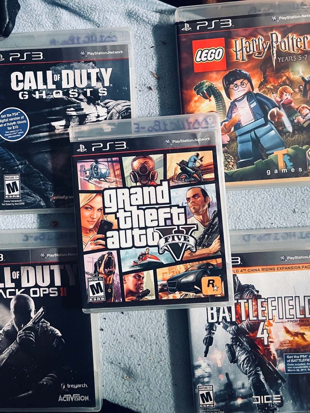 Sony PS3 Game Bundle GTA, Call of Duty Black Ops/Ghosts, Battlefield 4, and H.P